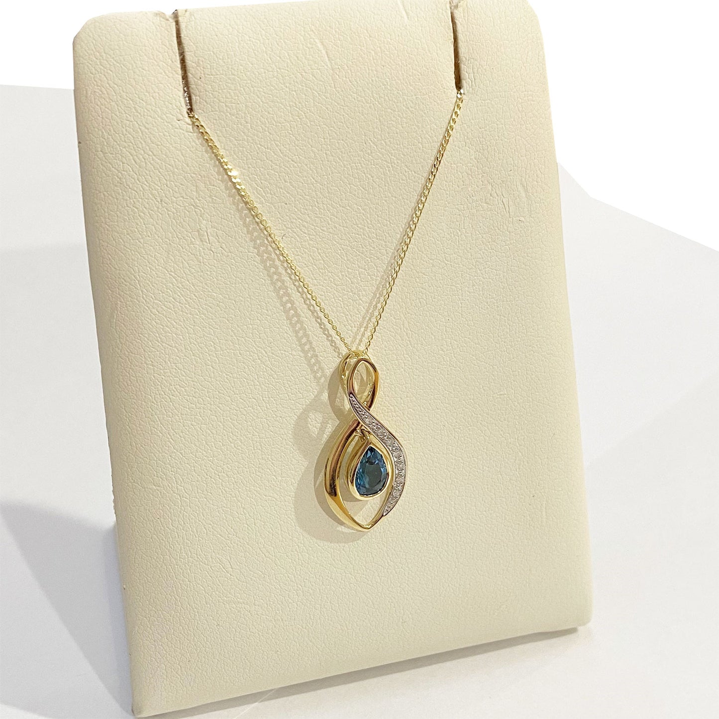 9ct Yellow Gold Blue Topaz And Diamond Twirl Pendant
