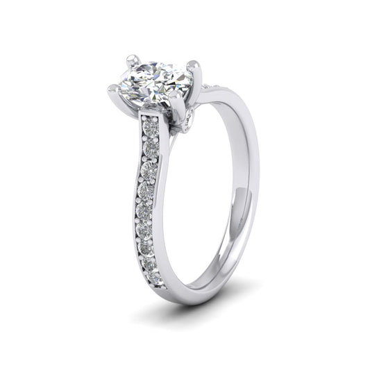 Platinum Four Claw Set Oval Diamond Ring With Shoulder Stones
