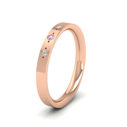 <p>9ct Rose Gold Three Diamond And Pink Sapphire Set Flat Wedding Ring.  25mm Wide And Court Shaped For Comfortable Fitting</p>