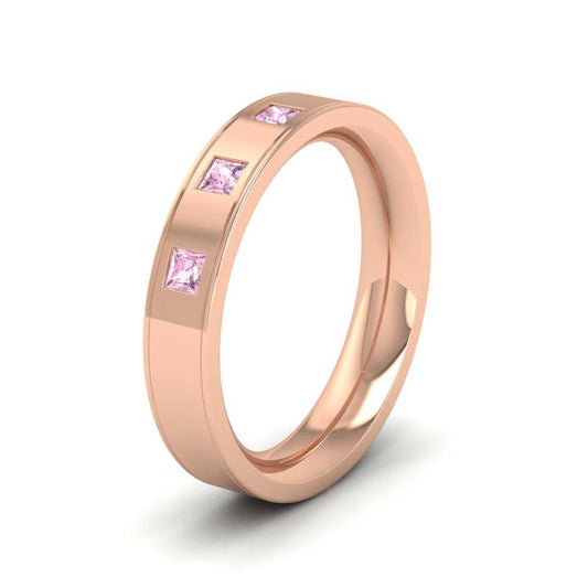 <p>9ct Rose Gold Princess Cut Pink Sapphire And Line Patterned Flat Wedding Ring.  4mm Wide And Court Shaped For Comfortable Fitting</p>