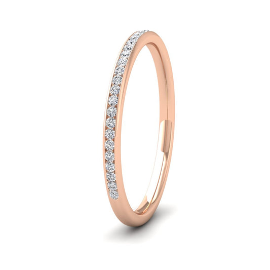 <p>18ct Rose Gold Half Channel Set 0.13ct Round Brilliant Cut Diamond Wedding Ring.  15mm Wide And Court Shaped For Comfortable Fitting</p>