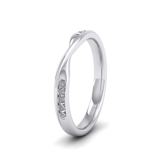 <p>18ct White Gold Crossover Pattern Wedding Ring With Eight Channel Set Diamonds.  25mm Wide And Court Shaped For Comfortable Fitting.  Suitable For Fitting Next To Single Stone Rings Where The Stone And Setting Protrude Up To 0.75mm Away From The Edge Of The Ring.</p>