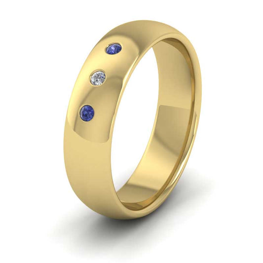<p>18ct Yellow Gold Blue Sapphire And Diamond Flush Set Wedding Ring.  6mm Wide And Court Shaped For Comfortable Fitting</p>