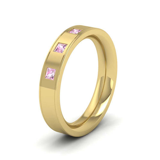 <p>9ct Yellow Gold Princess Cut Pink Sapphire And Line Patterned Flat Wedding Ring.  4mm Wide And Court Shaped For Comfortable Fitting</p>