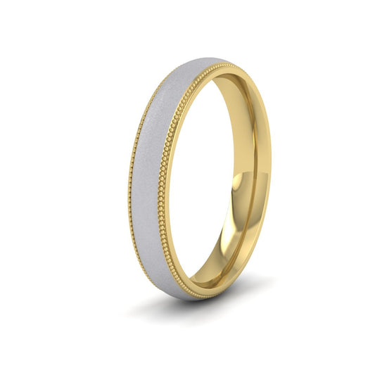 <p>Two Colour Wedding Ring In 9ct Yellow And White Gold With Millgrain Edge.  4mm Wide And Court Shaped For Comfortable Fitting (Shown With A Matt Finish)</p>