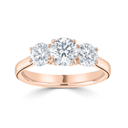 18ct Rose Gold Trilogy Diamond Ring. Slightly larger Centre Stone