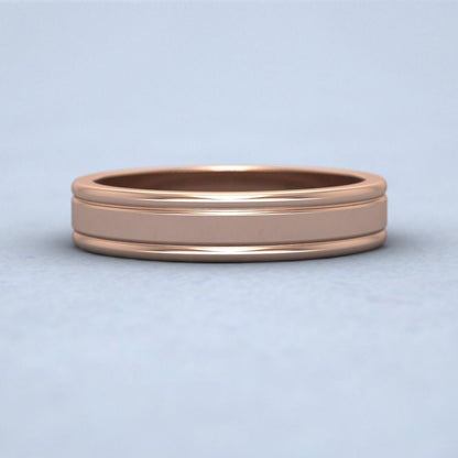 Rounded Edge Grooved Pattern Flat 9ct Rose Gold 4mm Flat Wedding Ring