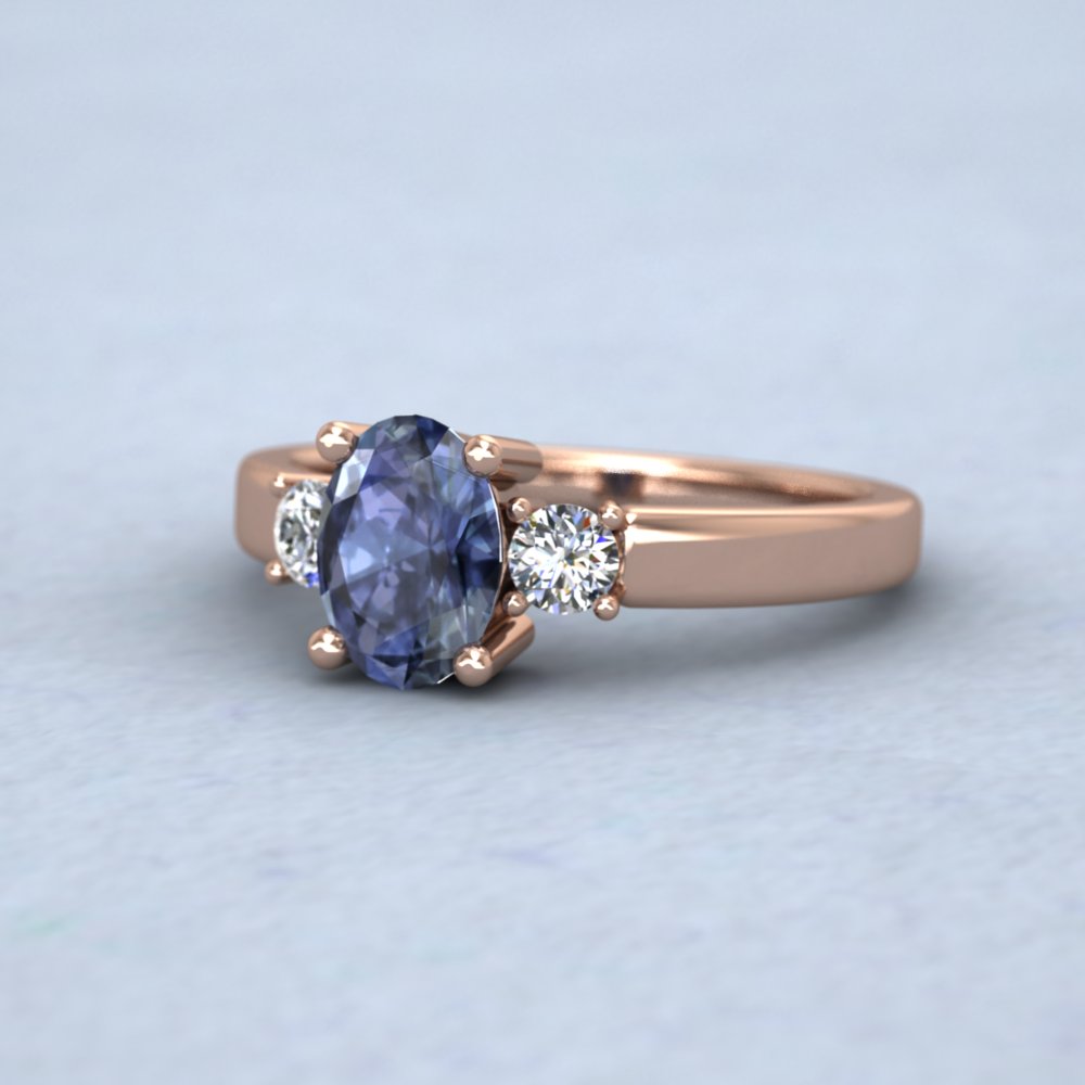9ct Rose Gold Claw Set Oval Blue Sapphire And Diamond Ring
