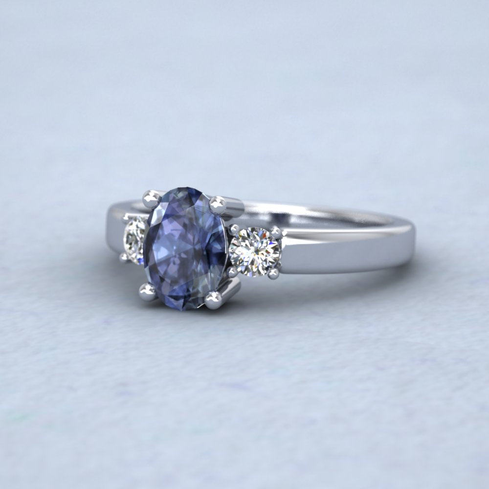 Platinum Claw Set Oval Blue Sapphire And Diamond Ring