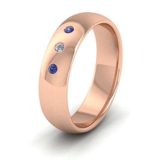<p>18ct Rose Gold Blue Sapphire And Diamond Flush Set Wedding Ring.  6mm Wide And Court Shaped For Comfortable Fitting</p>