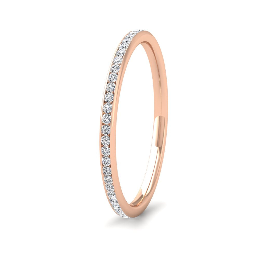<p>18ct Rose Gold Full Channel Set 0.26ct Round Brilliant Cut Diamond Wedding Ring.  15mm Wide And Court Shaped For Comfortable Fitting</p>