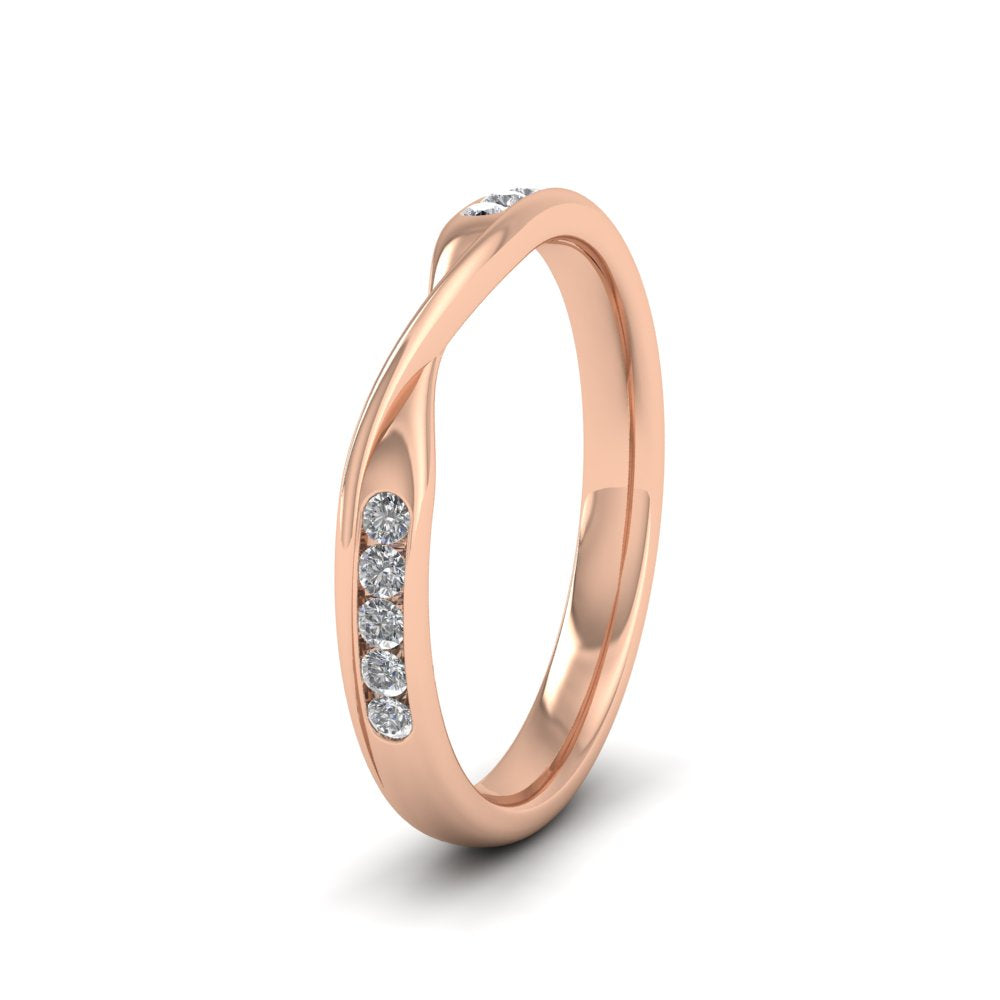 <p>9ct Rose Gold Crossover Pattern Wedding Ring With Eight Channel Set Diamonds.  25mm Wide And Court Shaped For Comfortable Fitting.  Suitable For Fitting Next To Single Stone Rings Where The Stone And Setting Protrude Up To 0.75mm Away From The Edge Of The Ring.</p>