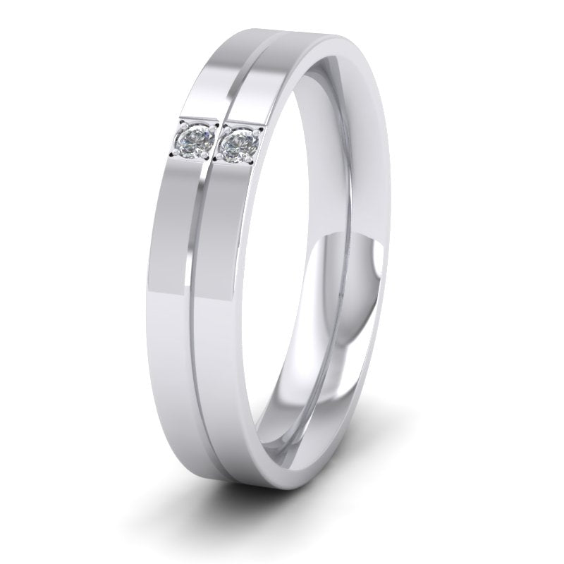 <p>Two Diamond And Line Pattern Flat Wedding Ring In 18ct White Gold.  4mm Wide And Court Shaped For Comfortable Fitting</p>