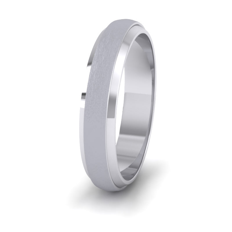 <p>18ct White Gold Flat Edge Patterned And Matt Finish Wedding Ring.  4mm Wide </p>
