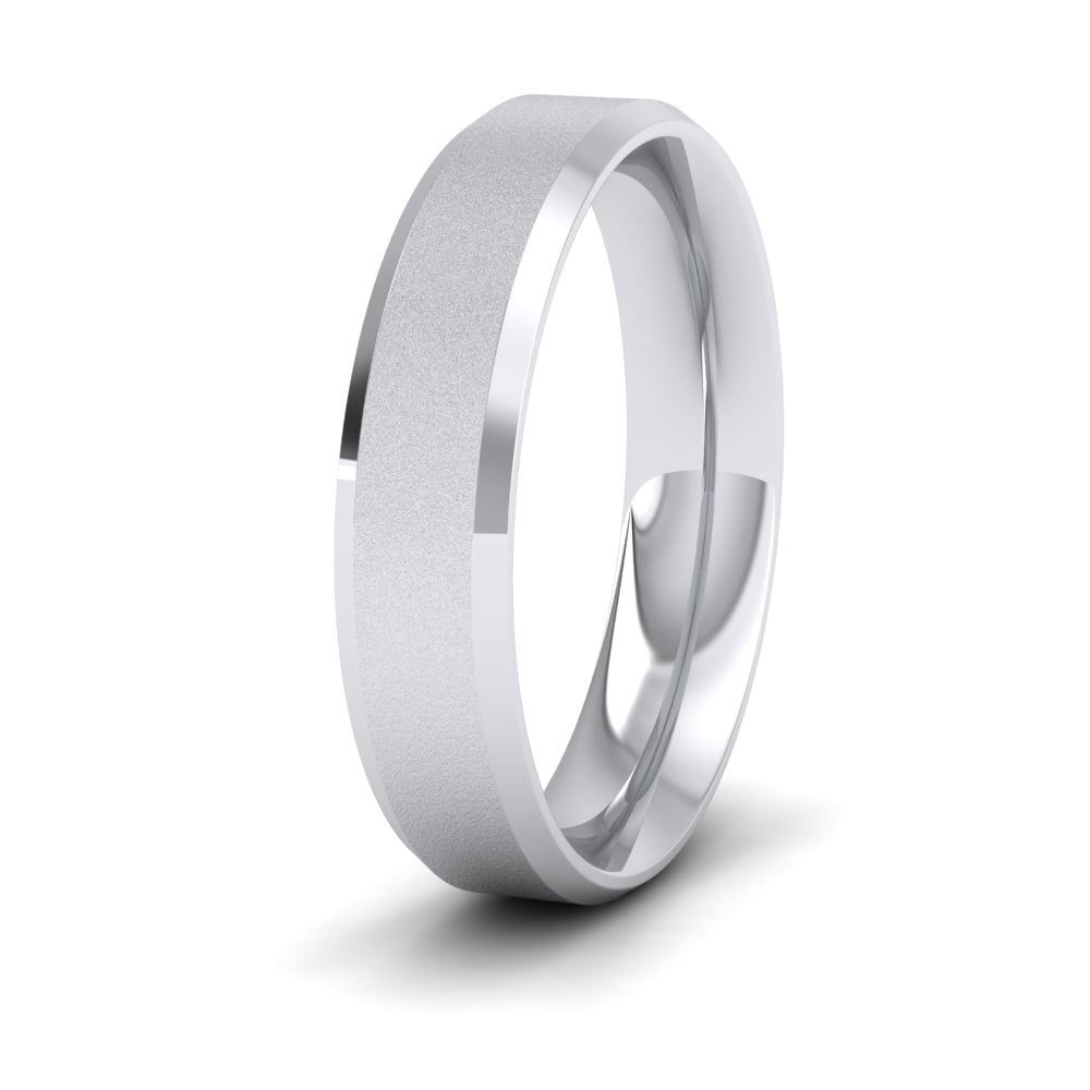 <p>18ct White Gold Bevelled Edge And Matt Finish Centre Flat Wedding Ring.  5mm Wide And Court Shaped For Comfortable Fitting</p>