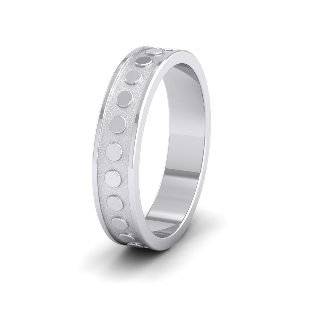 <p>9ct White Gold Raised Circle And Edge Patterned Flat Wedding Ring.  5mm Wide </p>
