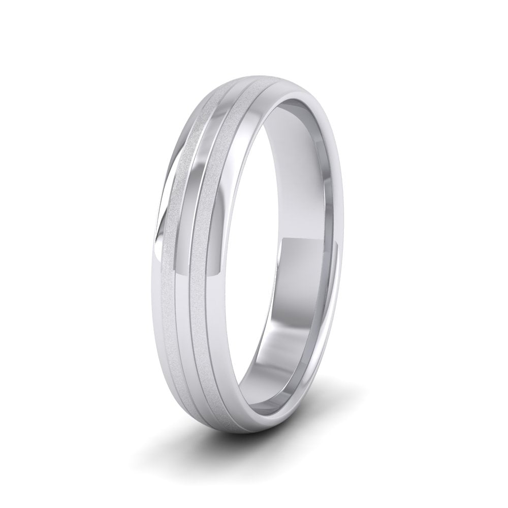 <p>18ct White Gold Four Line Pattern With Shiny And Matt Finish Wedding Ring.  4mm Wide And Court Shaped For Comfortable Fitting</p>