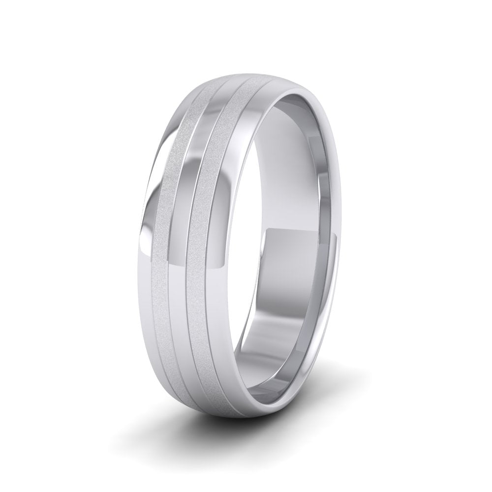 <p>18ct White Gold Four Line Pattern With Shiny And Matt Finish Wedding Ring.  6mm Wide And Court Shaped For Comfortable Fitting</p>