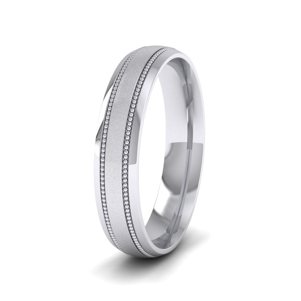 <p>18ct White Gold Millgrain And Contrasting Matt And Shiny Finish Wedding Ring.  4mm Wide And Court Shaped For Comfortable Fitting</p>