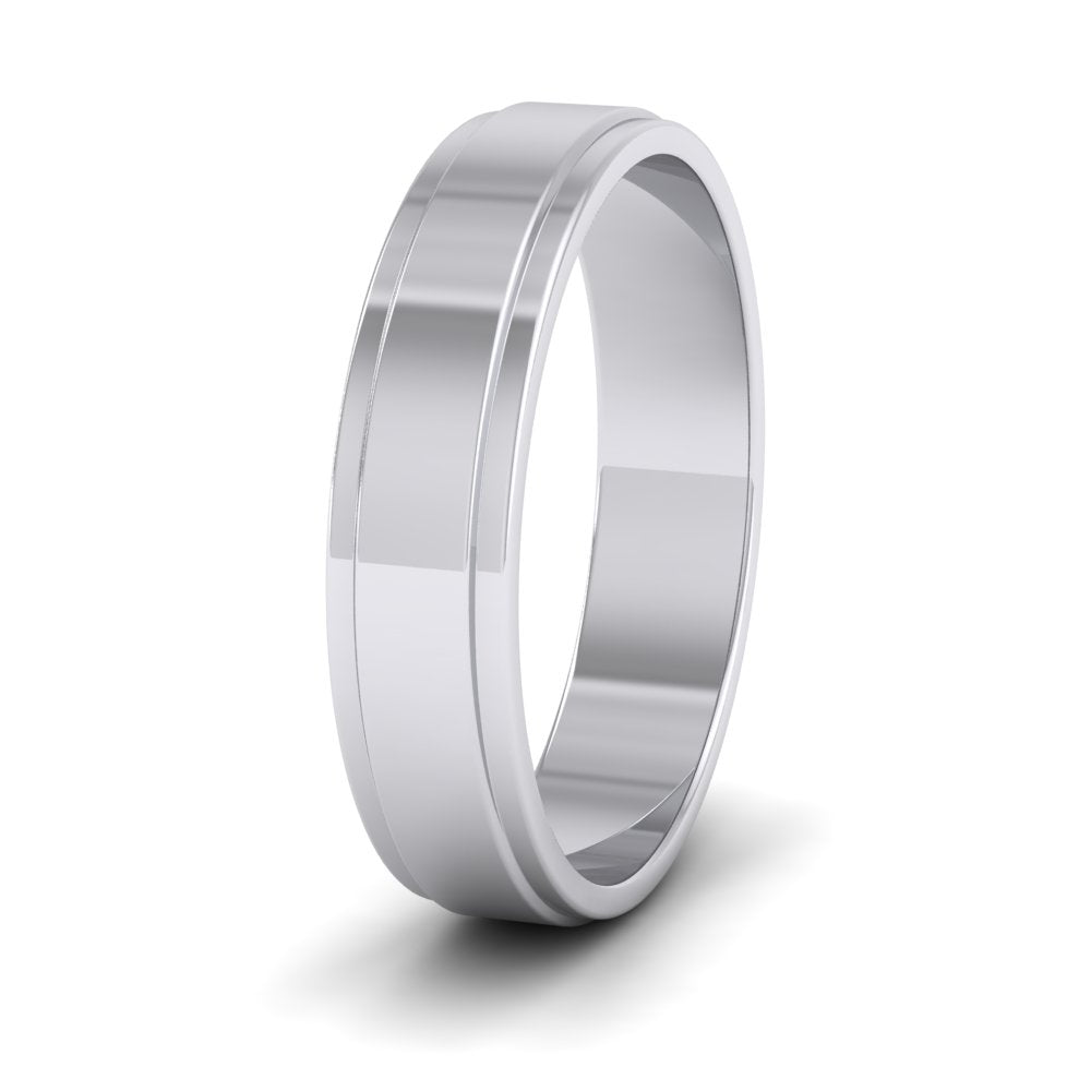 <p>18ct White Gold Stepped Edge Pattern Flat Wedding Ring.  5mm Wide </p>