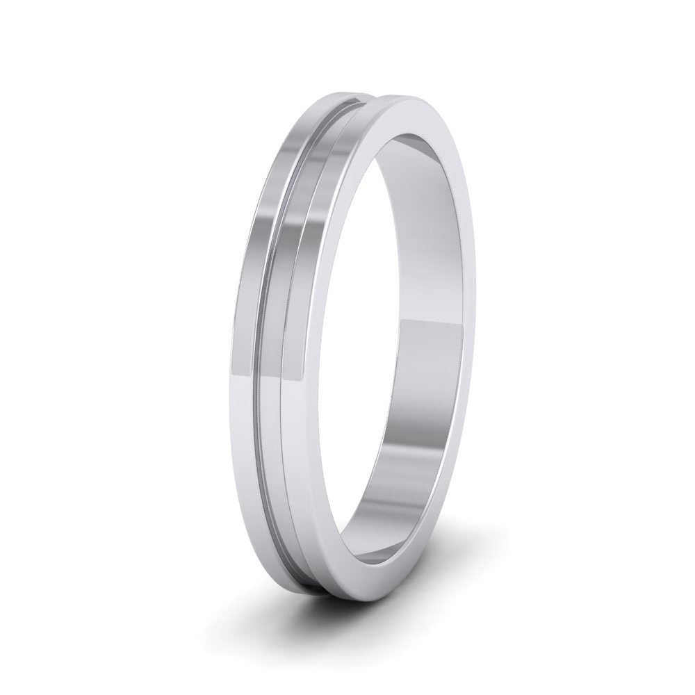 <p>14ct White Gold Flat Central Grooved Wedding Ring.  3mm Wide </p>
