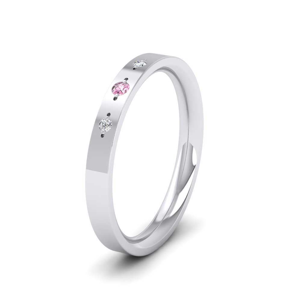 <p>500 Palladium Three Diamond And Pink Sapphire Set Flat Wedding Ring.  25mm Wide And Court Shaped For Comfortable Fitting</p>