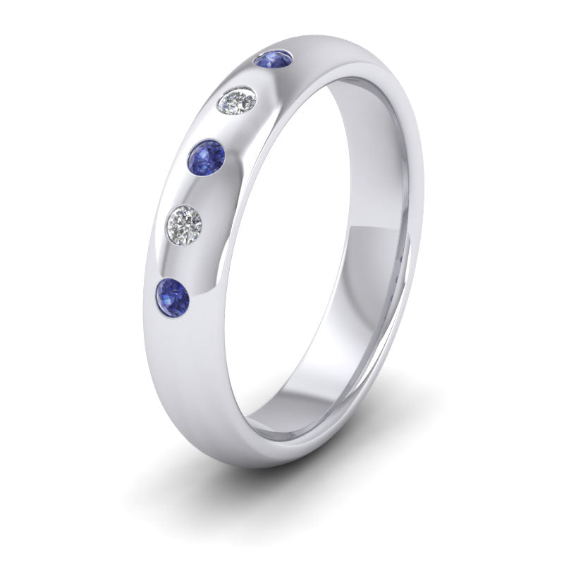 <p>18ct White Gold Blue Sapphire And Diamond Flush Set Wedding Ring.  4mm Wide And Court Shaped For Comfortable Fitting</p>