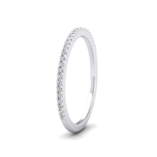 <p>18ct White Gold Round Claw 0.13ct Half Diamond Set Wedding Ring.  15mm Wide And Court Shaped For Comfortable Fitting</p>