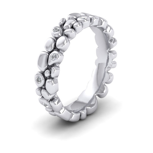 <p>Pebbles Wedding Ring In 9ct White Gold With Diamonds.  5mm Wide And Court Shaped For Comfortable Fitting</p>