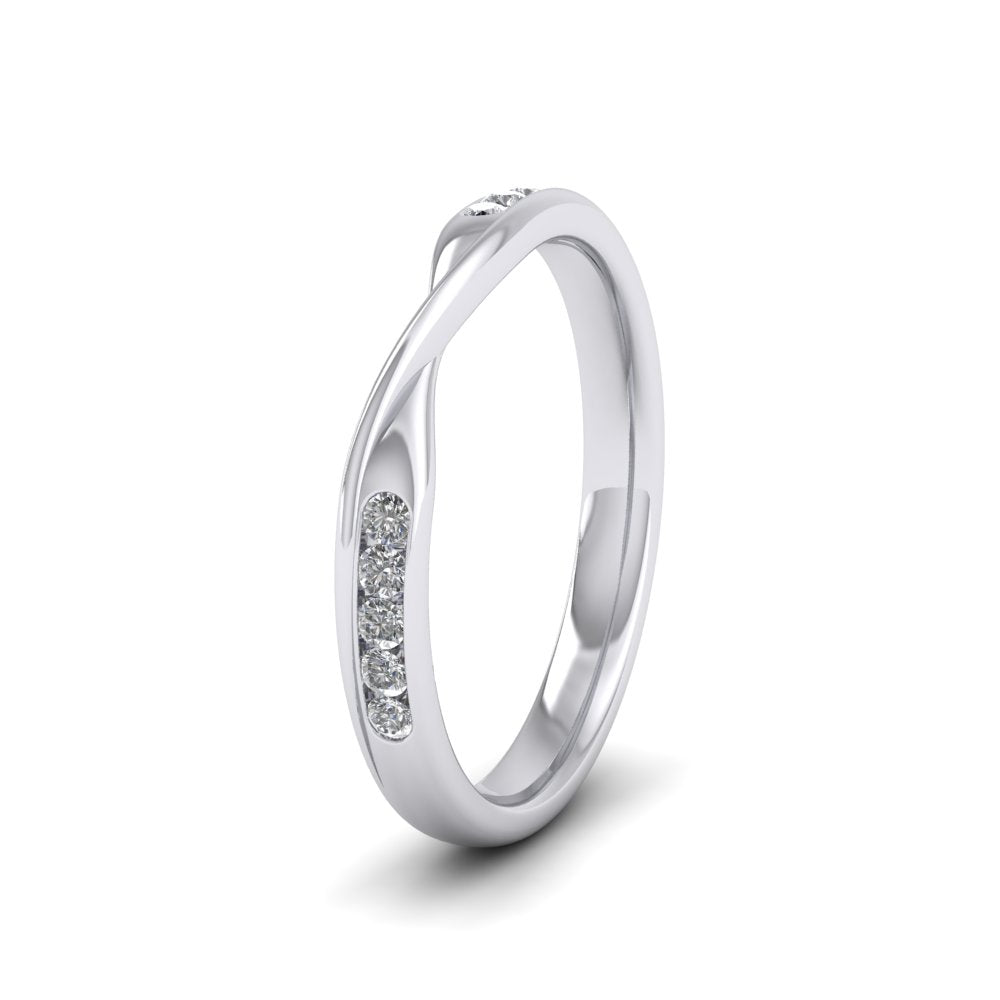 <p>9ct White Gold Crossover Pattern Wedding Ring With Eight Channel Set Diamonds.  25mm Wide And Court Shaped For Comfortable Fitting.  Suitable For Fitting Next To Single Stone Rings Where The Stone And Setting Protrude Up To 0.75mm Away From The Edge Of The Ring.</p>