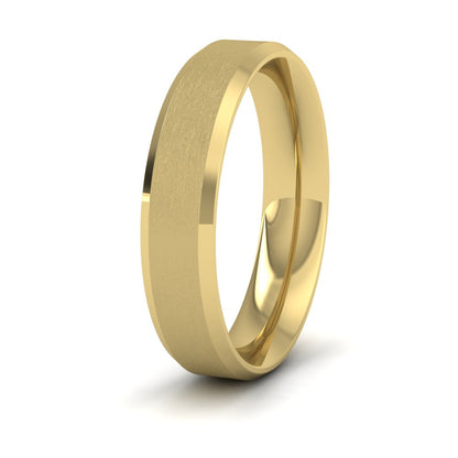 <p>22ct Yellow Gold Bevelled Edge And Matt Finish Centre Flat Wedding Ring.  5mm Wide And Court Shaped For Comfortable Fitting</p>