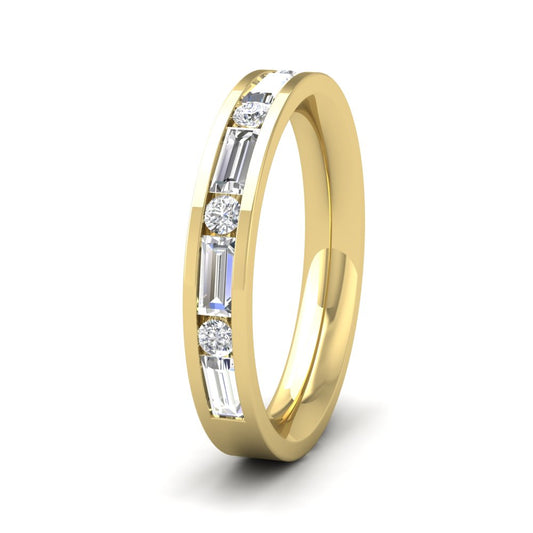 <p>18ct Yellow Gold Channel Set Alternate Baguette And Round Diamond Ring (0.75ct). 35mm Wide And Court Shaped For Comfortable Fitting</p>