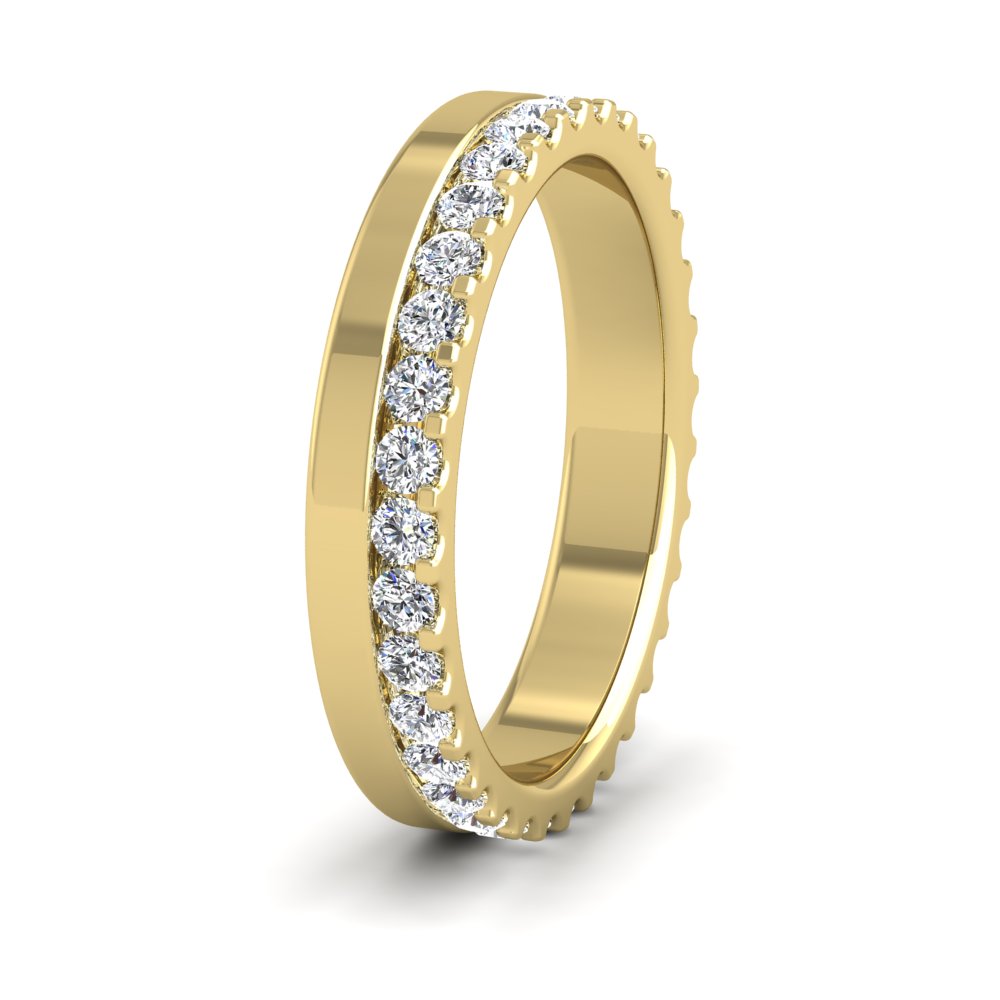 <p>18ct Yellow Gold Asymmetric Full Claw Set Diamond Ring (0.64ct) .  35mm Wide And Court Shaped For Comfortable Fitting</p>